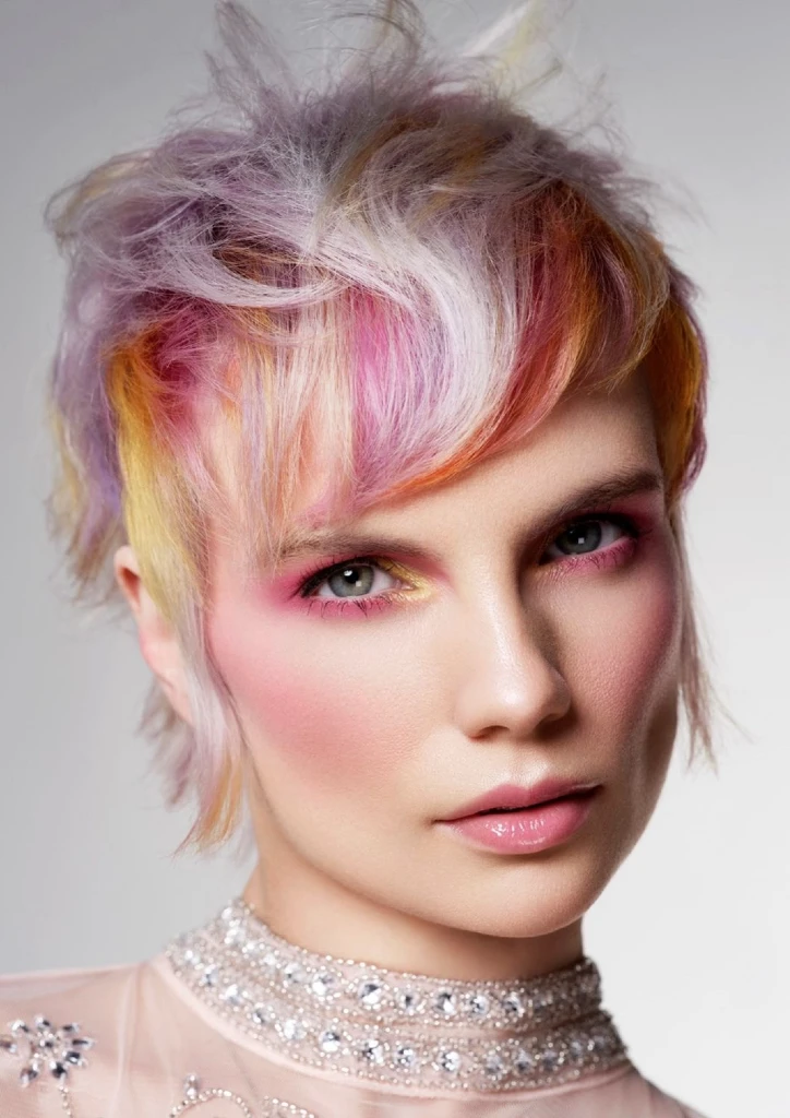 Ash blonde pixie crop with panels of lilac, deep pink and gold